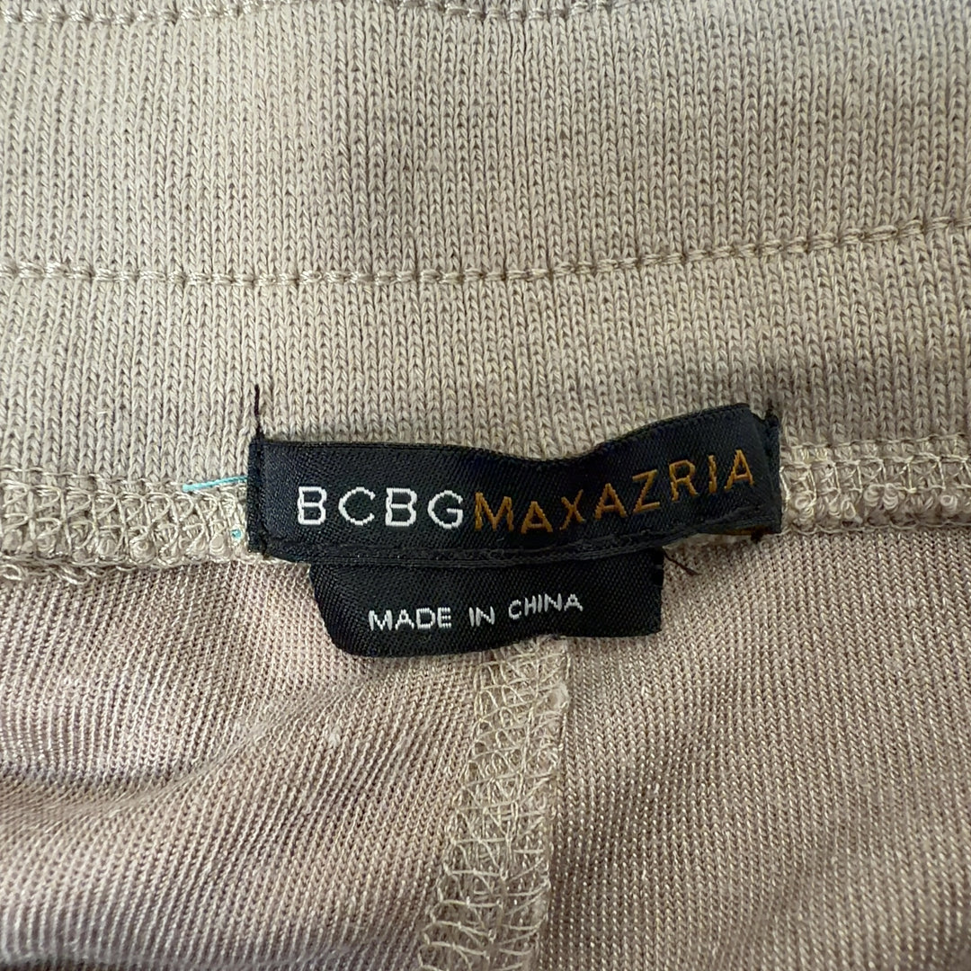 Tag view of cream velvet cropped jogger pants showing relaxed fit and ankle length by BCBG MaxAzria