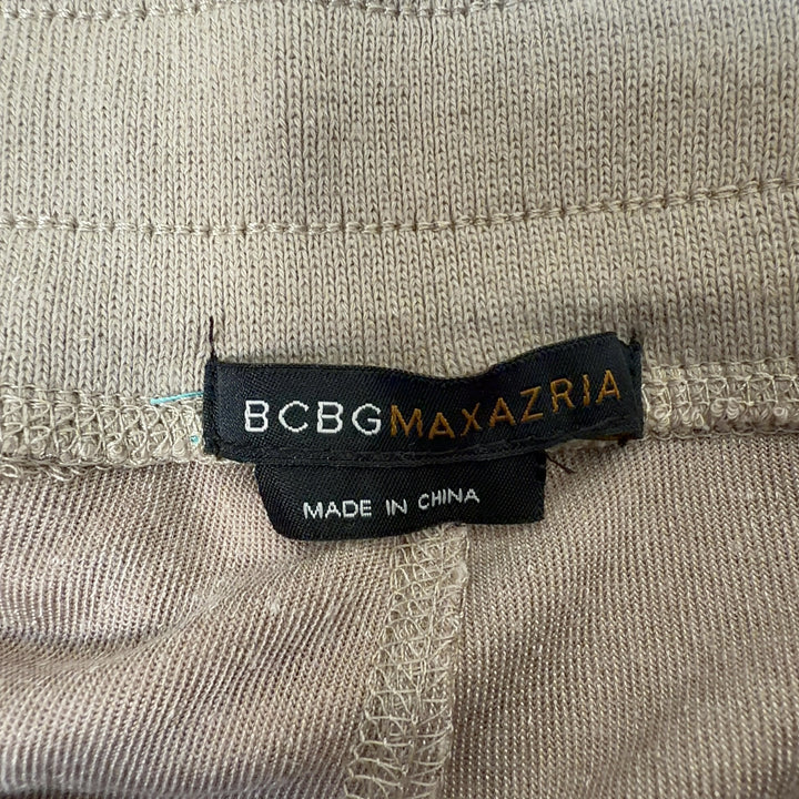 Tag view of cream velvet cropped jogger pants showing relaxed fit and ankle length by BCBG MaxAzria
