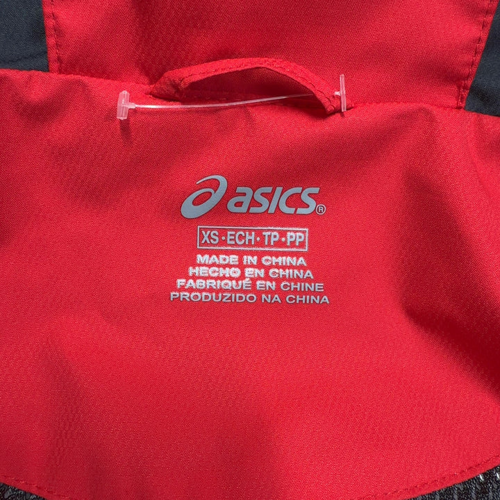 Red Asics windbreaker jacket back view showing full-length design and black hood