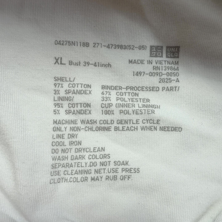 Cream ribbed sleeveless tank top back view, showing fitted silhouette