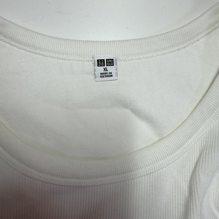 Cream ribbed sleeveless tank top back view, showing fitted silhouette