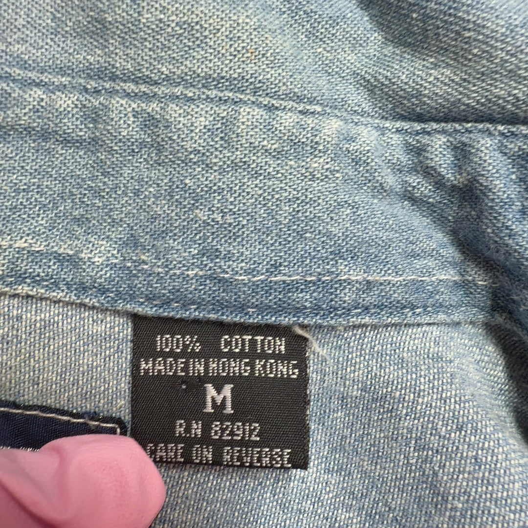 Light blue denim button-up shirt with teddy bear embroidery, back view