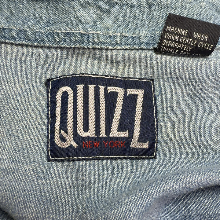 Light blue denim button-up shirt with teddy bear embroidery, back view