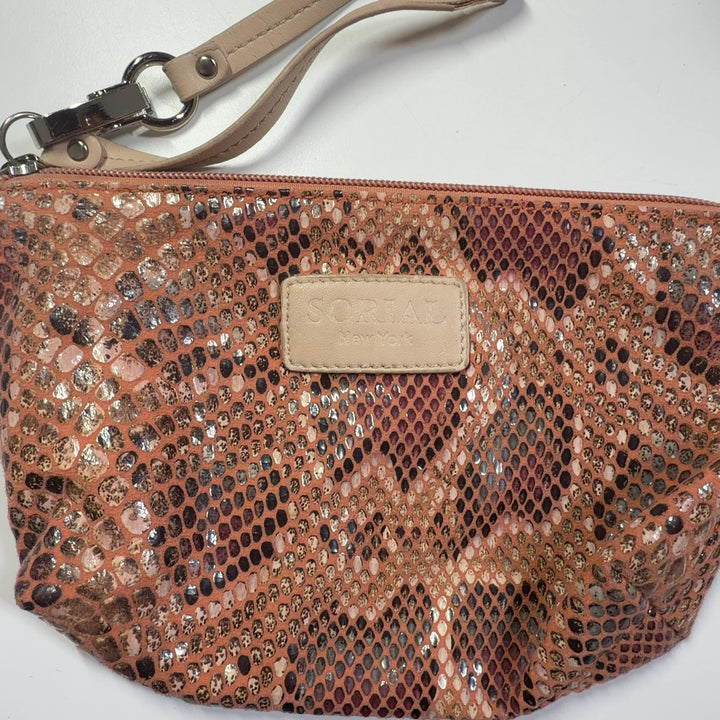 Tan python print clutch styled as evening accessory with gold-tone hardware