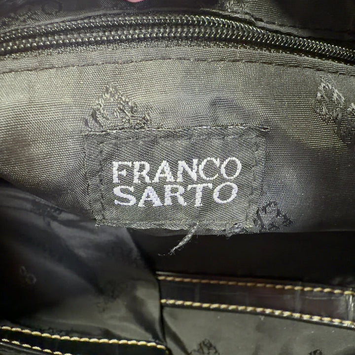 Black and gold zebra print Franco Sarto clutch with croc-embossed handle, back view styled with outfit