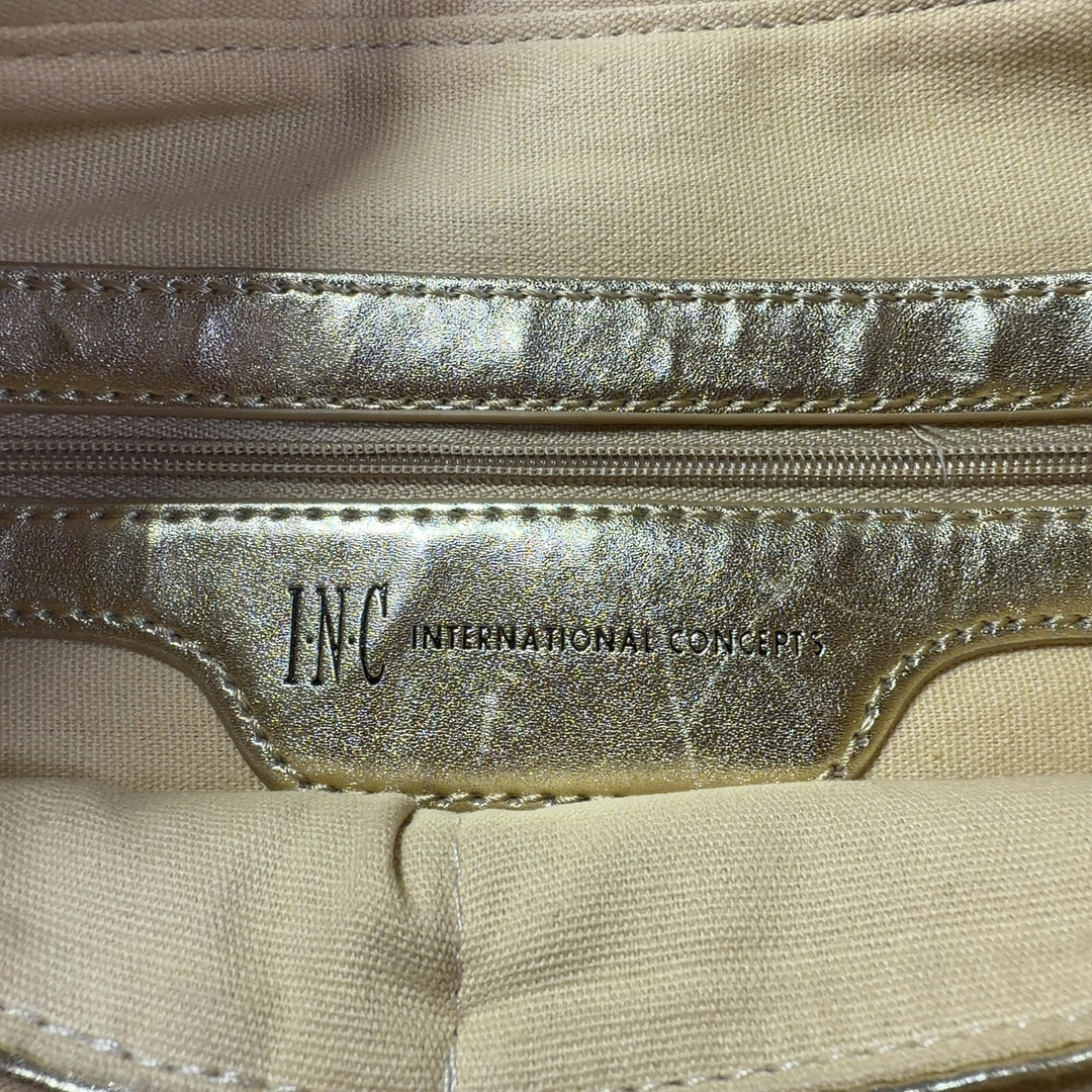 Tag view of gray ikat shoulder bag worn as crossbody style on model