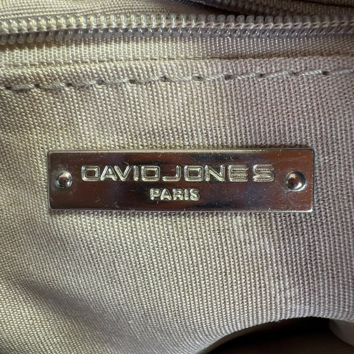 Tag view of sage green David Jones Paris crossbody bag worn on shoulder, showing structured silhouette and strap adjustment
