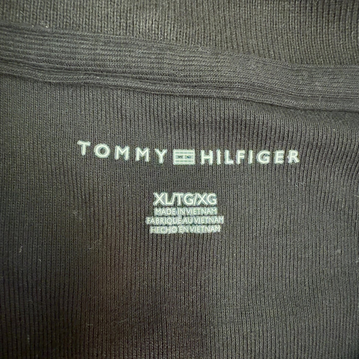 Black cotton polo shirt dress with white-tipped collar, back view showing A-line silhouette