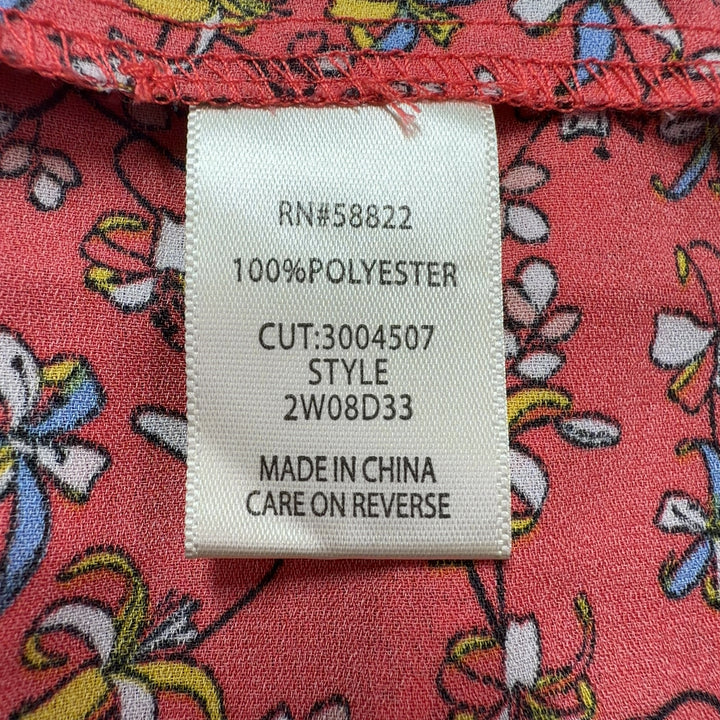 Red floral pleated cape top by Max Studio, back view displaying pleated detailing and decorative border trim