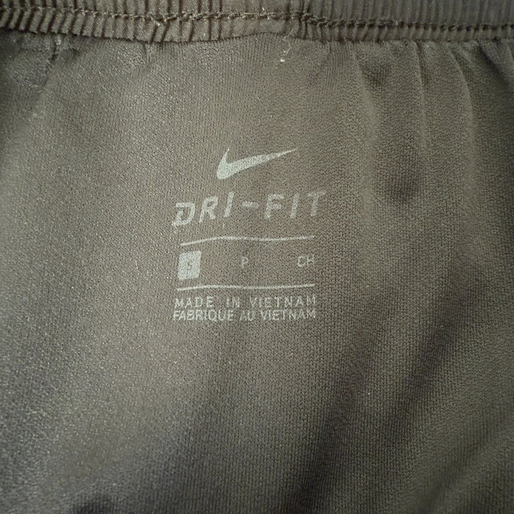Black Nike athletic shorts with pink trim, back view displaying fit and athletic design