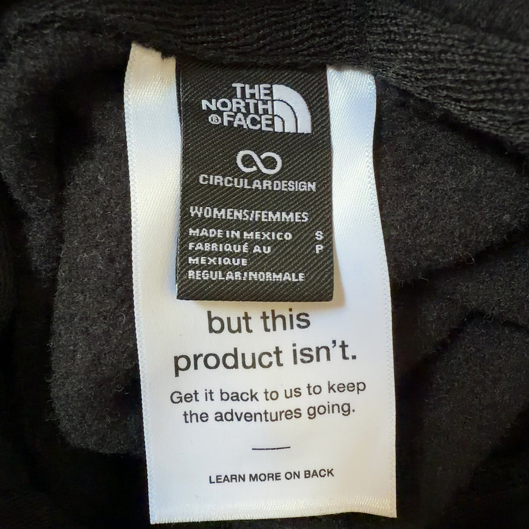Tag view of black The North Face hoodie displaying logo placement and relaxed fit silhouette