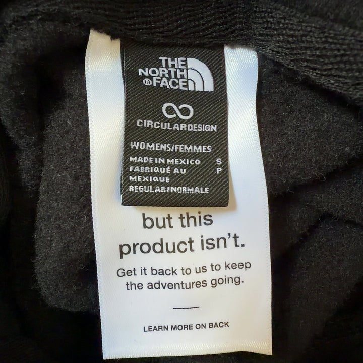 Tag view of black The North Face hoodie displaying logo placement and relaxed fit silhouette