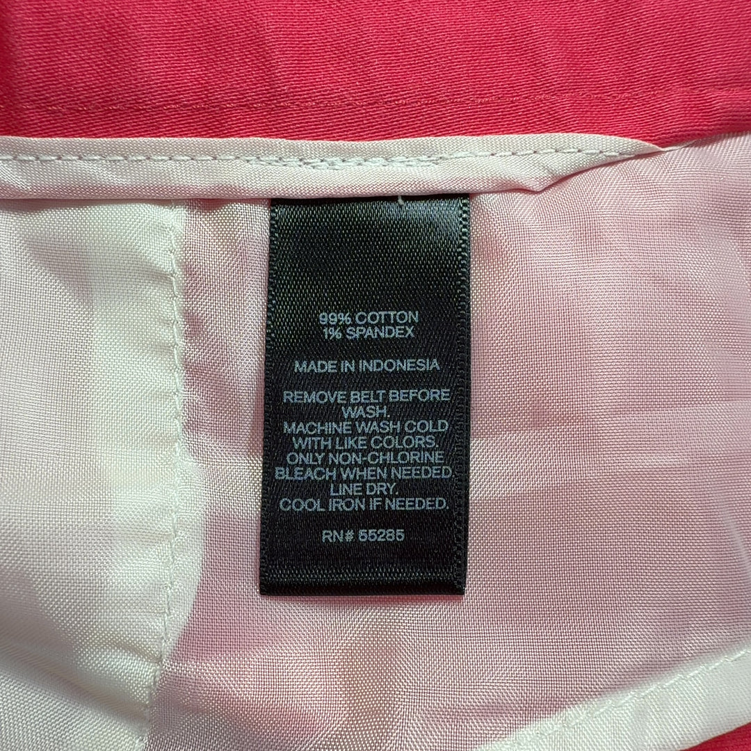 Tag view of red cotton-spandex tailored shorts from Express, showing clean lines and flattering fit