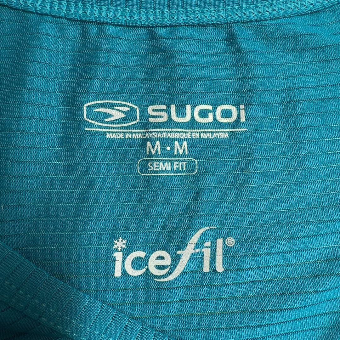 Teal V-neck sleeveless activewear tank top by SUGOI, back view on model