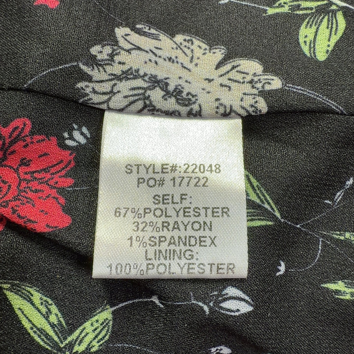 Tag view of gray knit blazer showing tailored fit and three-quarter sleeve length