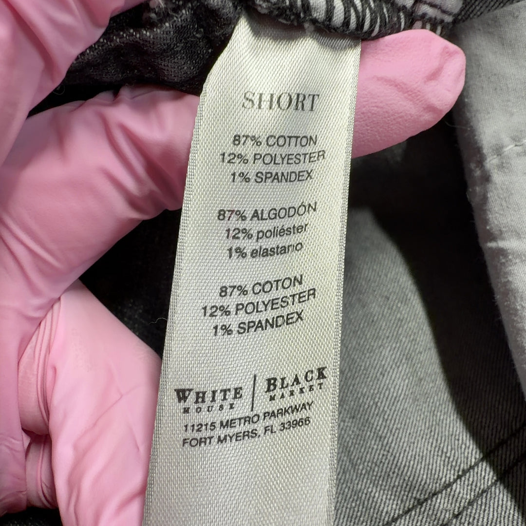 Tag view of charcoal denim shorts showing the fit and rolled cuff detail