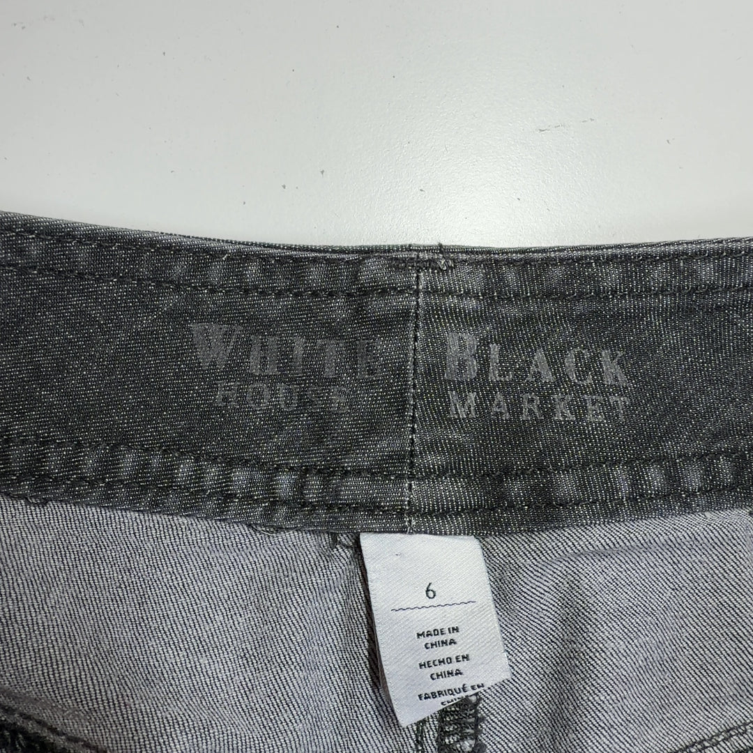 Tag view of charcoal denim shorts showing the fit and rolled cuff detail