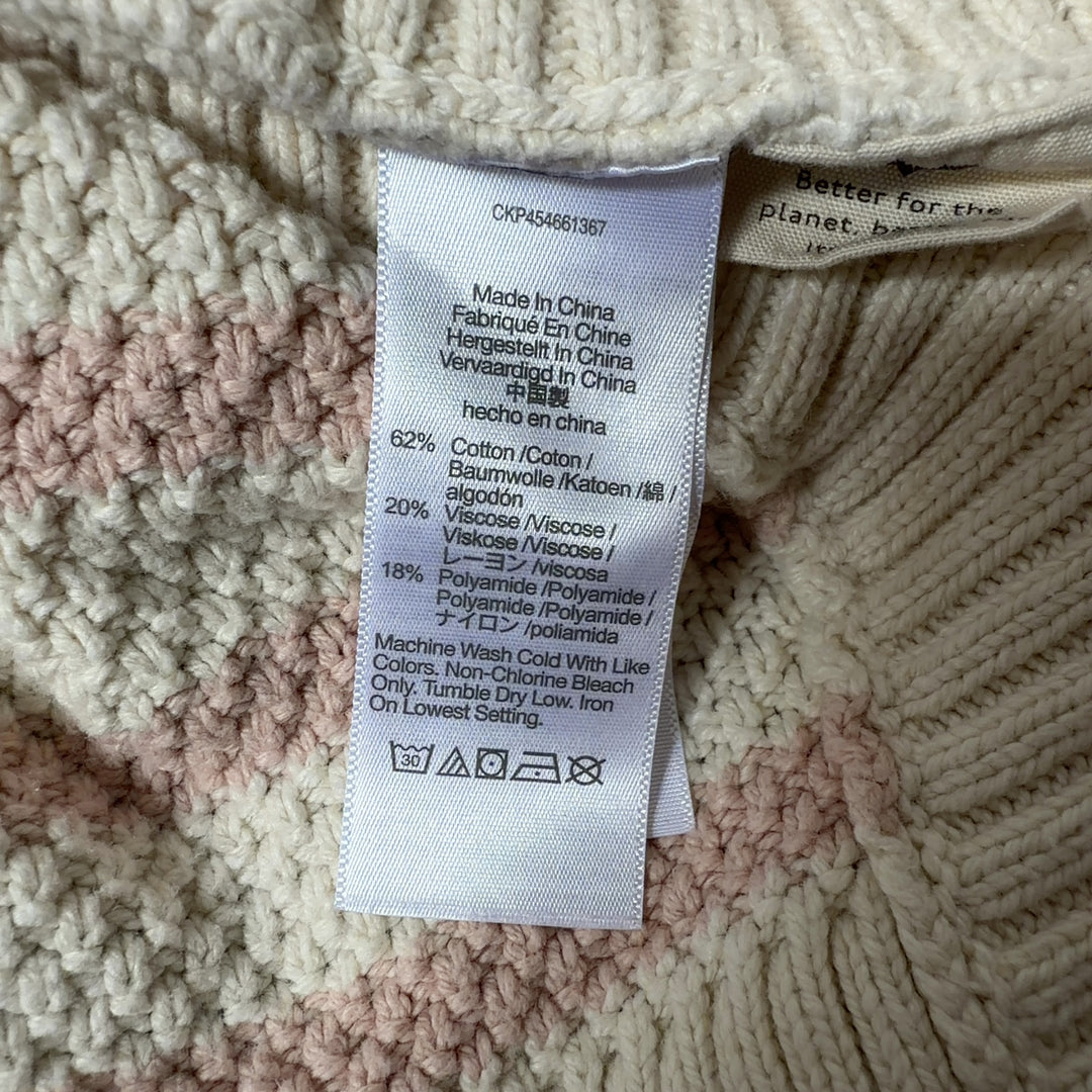 Cream and blush striped knit pullover sweater with cropped hem, back view
