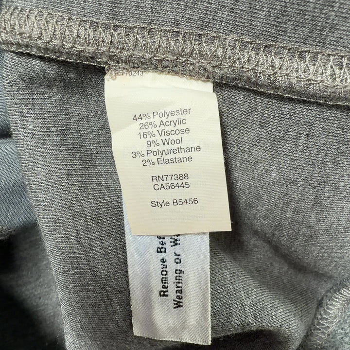Tag view of gray wool-blend shift dress showing relaxed silhouette and side pocket detail