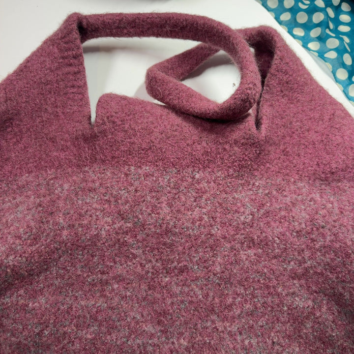 SilkRoll burgundy wool hobo tote bag worn on shoulder, displaying back view and spacious interior design