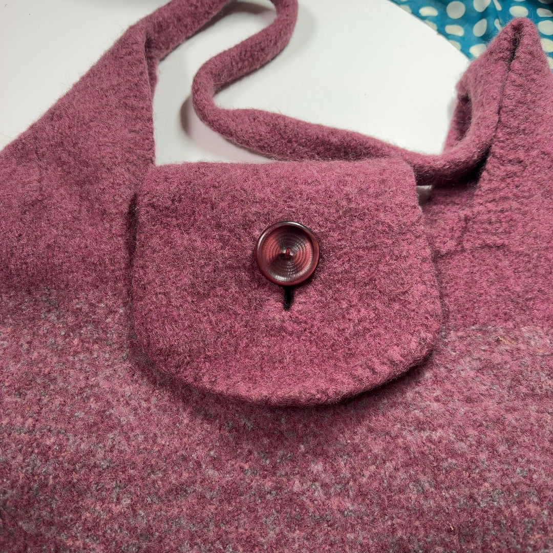 SilkRoll burgundy wool hobo tote bag worn on shoulder, displaying back view and spacious interior design