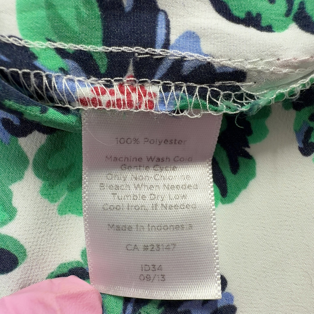 Cream sleeveless tank top with green and multicolor floral print, back view