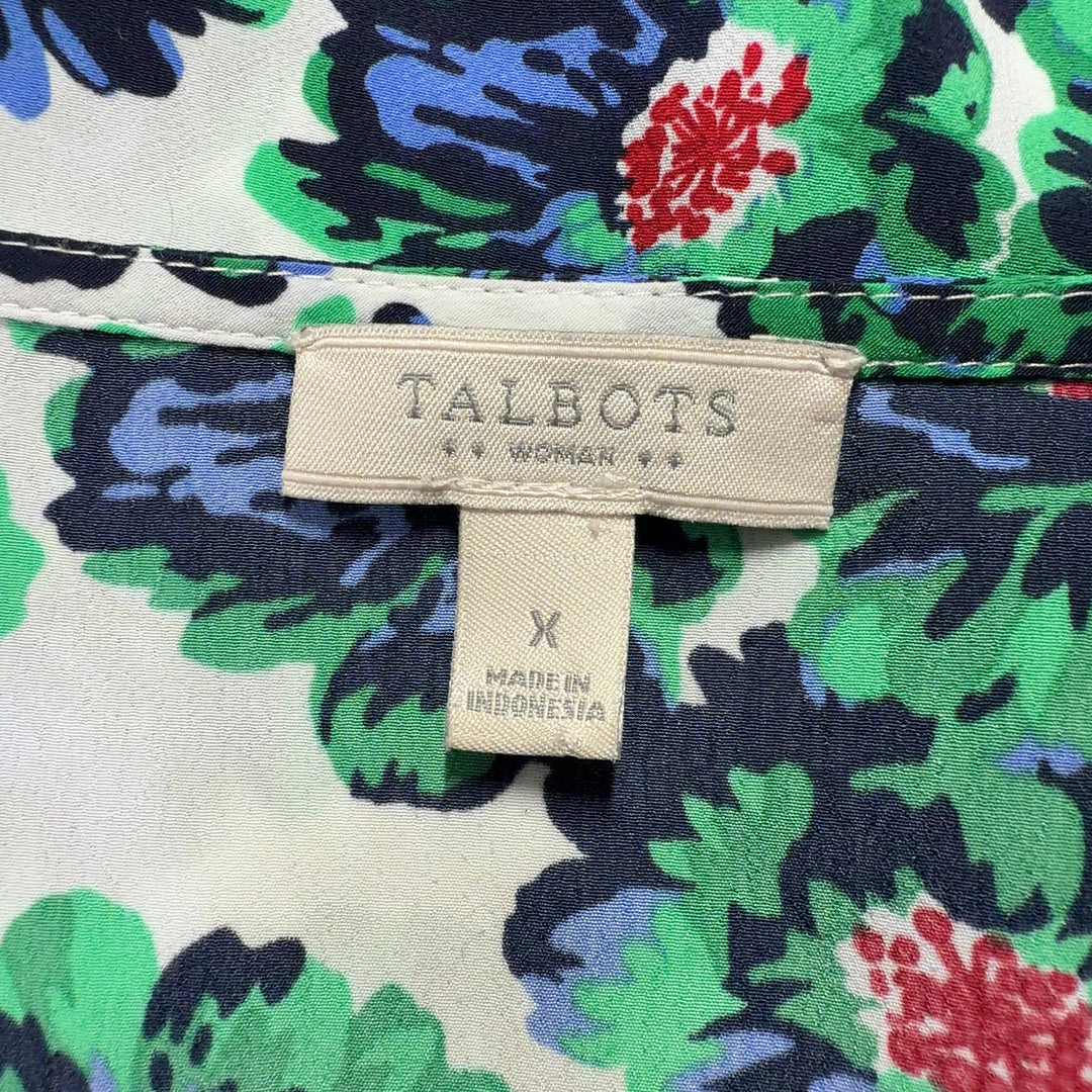 Cream sleeveless tank top with green and multicolor floral print, back view