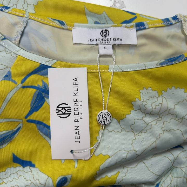 Tag view of yellow floral print shift dress showing the full botanical pattern and relaxed shift silhouette