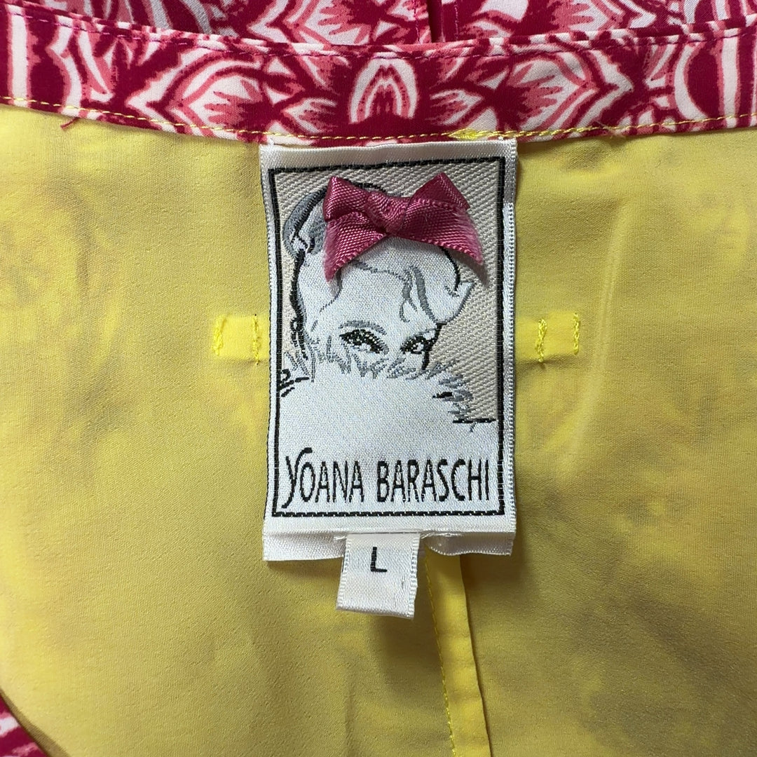 Tag view of pink ornate paisley tunic top by Yoana Baraschi showing full length and magenta side panels with yellow trim