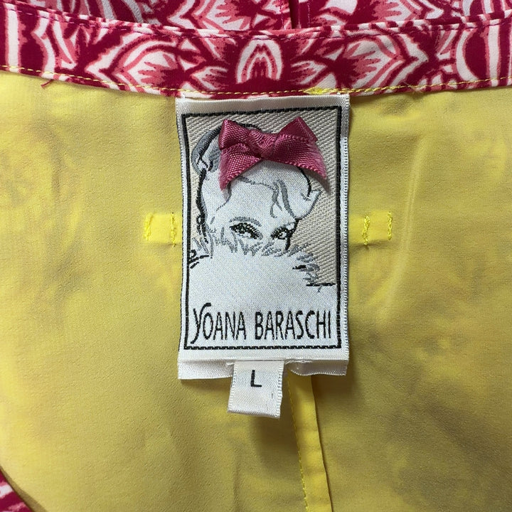 Tag view of pink ornate paisley tunic top by Yoana Baraschi showing full length and magenta side panels with yellow trim