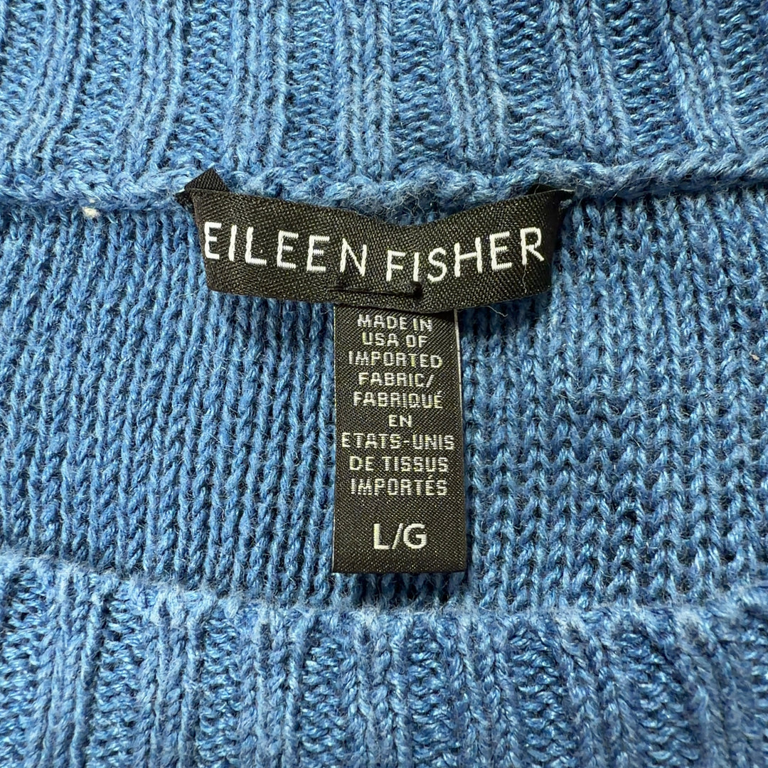 Blue linen knit sweater back view showing relaxed fit and ribbed hem detail
