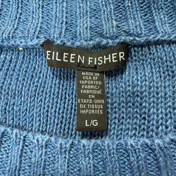 Blue linen knit sweater back view showing relaxed fit and ribbed hem detail