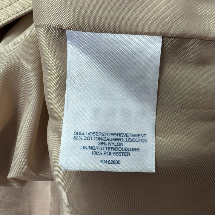 Beige trench coat with tied belt detail, back view showing knee-length cut