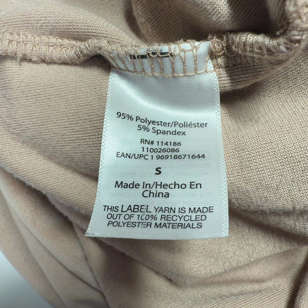 Beige velour activewear pants back view, showing straight-leg silhouette and fit