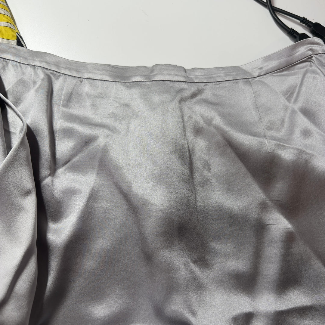 Cream silk pencil skirt back view, displaying elegant drape and classic straight cut design