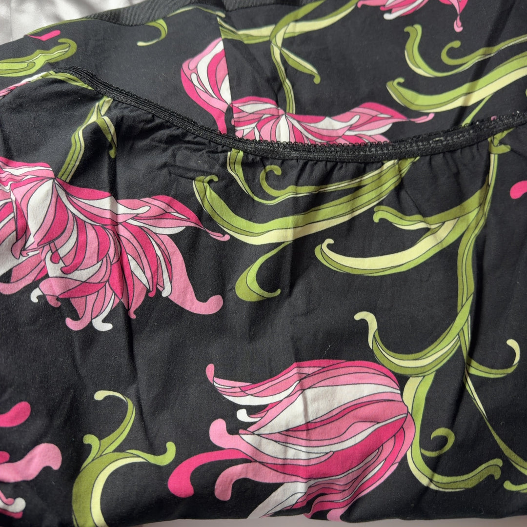 Black floral A-line midi skirt with pink flowers and green foliage, back view