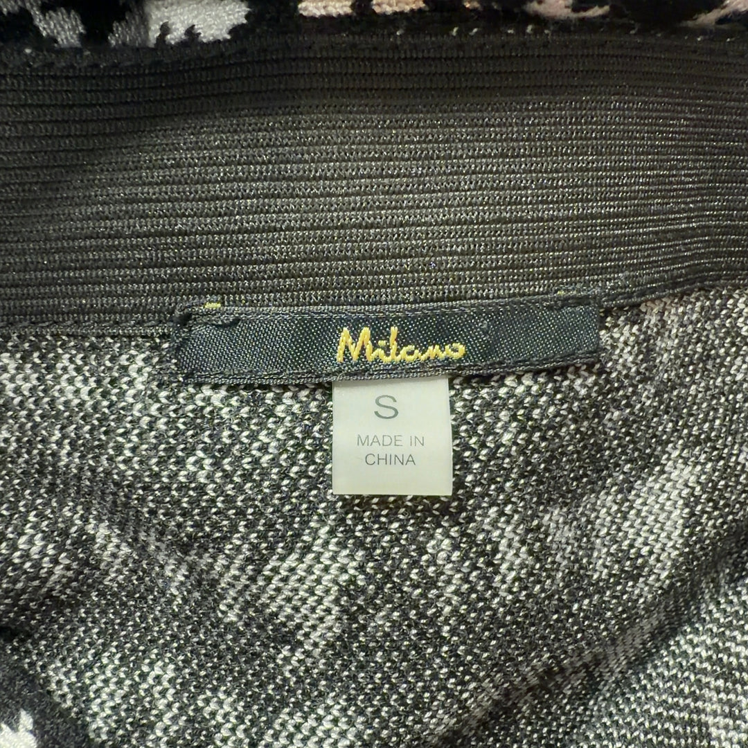 Black and white houndstooth pencil skirt with frayed hem, back view on model