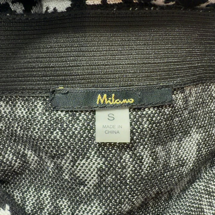 Black and white houndstooth pencil skirt with frayed hem, back view on model