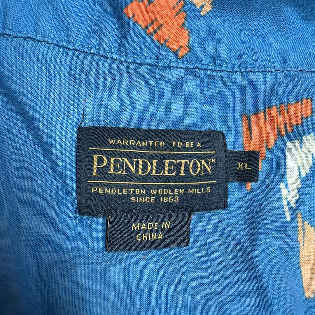 Blue abstract geometric print cotton button-up shirt, back view showing relaxed fit