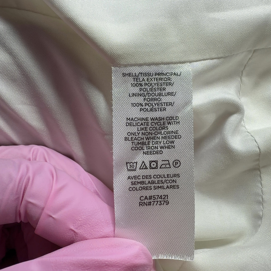 Cream polyester button-up jacket back view showing relaxed fit and functional side pockets