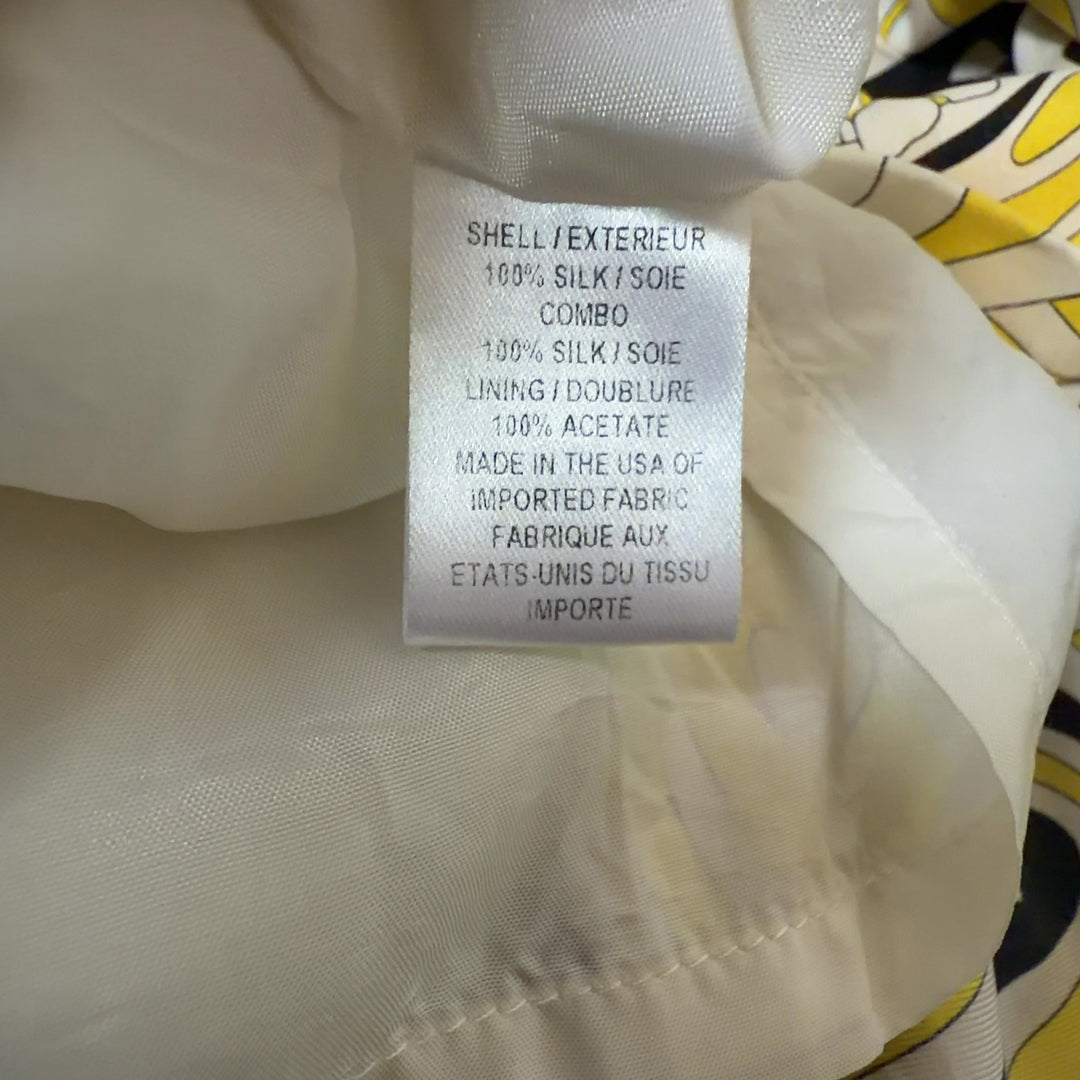 Yellow and black abstract silk halter dress with color-blocked waistband, back view