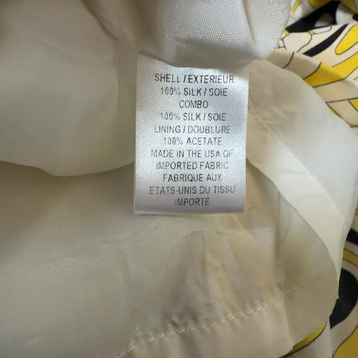 Yellow and black abstract silk halter dress with color-blocked waistband, back view