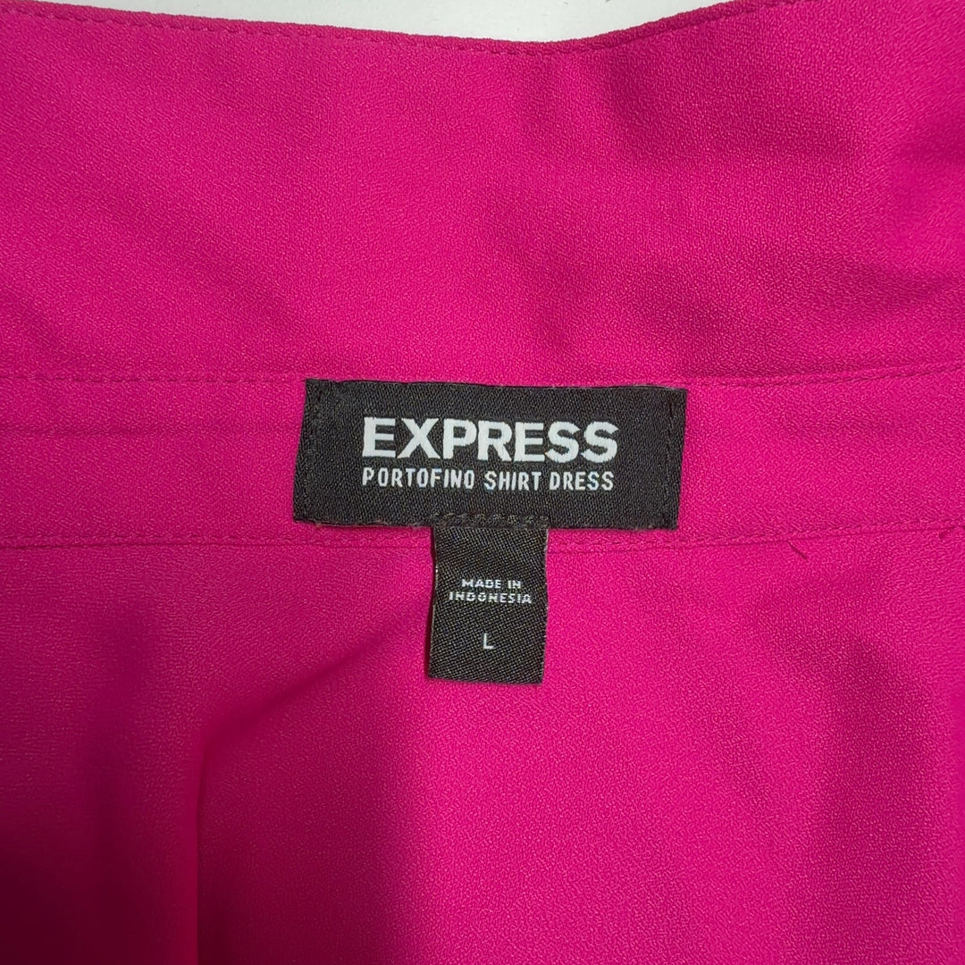 Tag view of pink button-front shirt dress showing high-low hemline and relaxed silhouette
