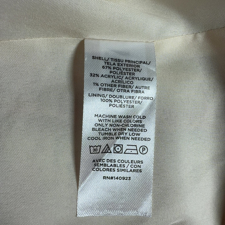 Tag view of LOFT beige tweed blazer jacket showing structured silhouette and button details