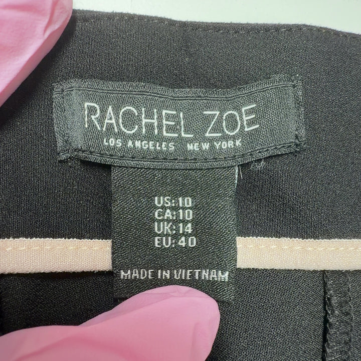 Black flare pants with high-waisted silhouette and stretchy fabric, back view