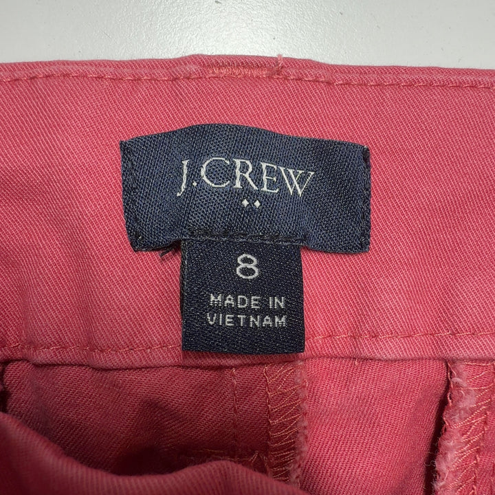 Red cotton bermuda shorts back view showing pocket detail and flattering silhouette