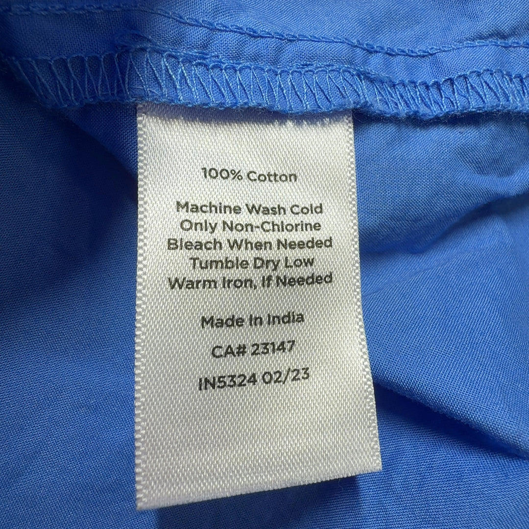 Blue cotton long sleeve henley top, back view showing relaxed fit and sleeve detail