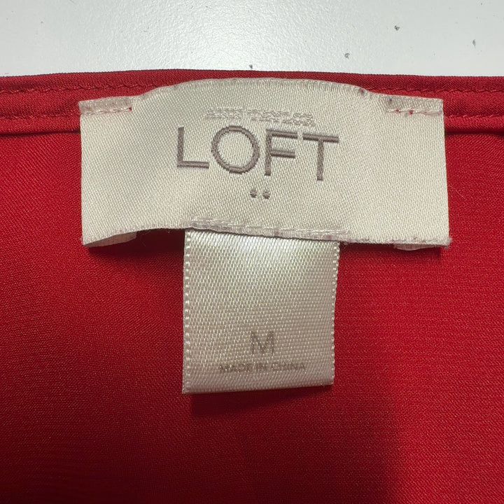 Red ruffle off-shoulder blouse with ruffled sleeves and gathered waist, back view