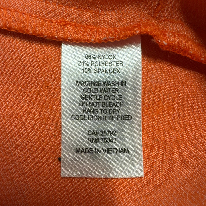 Tag view of orange cropped pants by Rachel Zoe showing sleek silhouette and fit