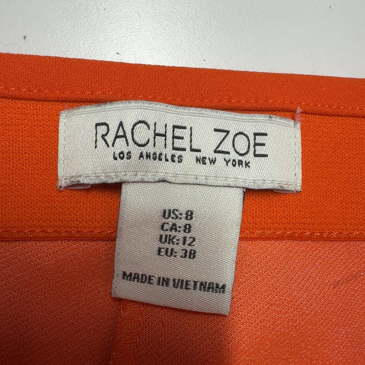 Tag view of orange cropped pants by Rachel Zoe showing sleek silhouette and fit